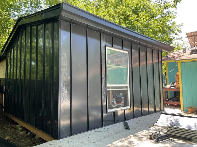 Black standing seam metal wall panels for Roof Inspection in Millcreek