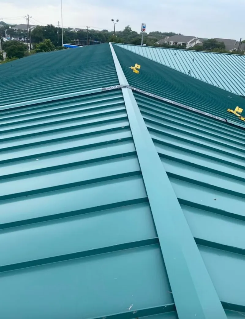 Green commercial metal roof ridge and valley for Metal Roof Repair in Millcreek